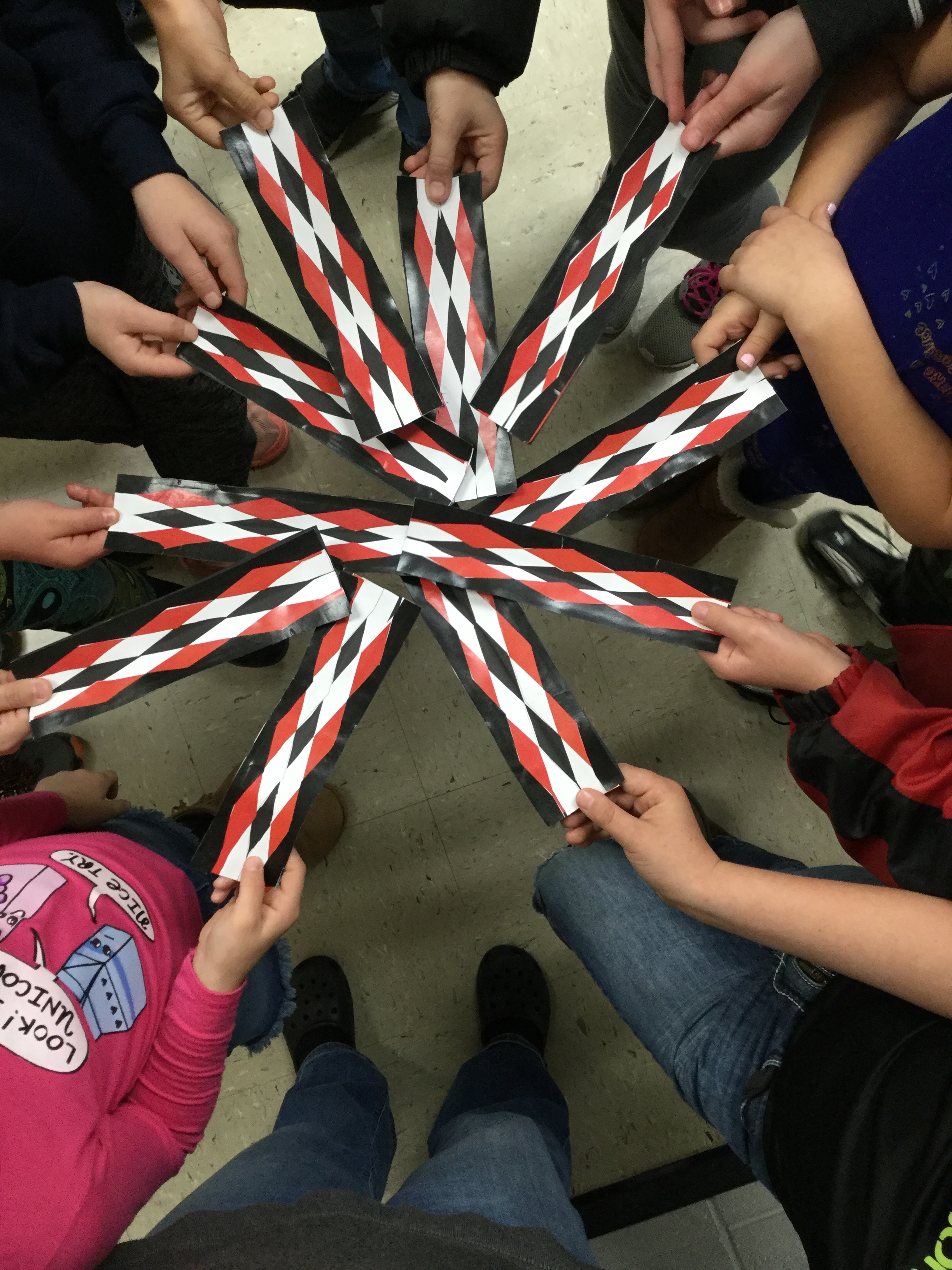 Traditional Myaamia geometric pattern artwork in red, white, and black